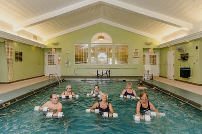 Residents participating in an aquatic exercise class