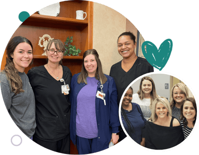 Staff members posing together in a common area
