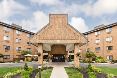 Exterior view of a senior care facility entrance.
