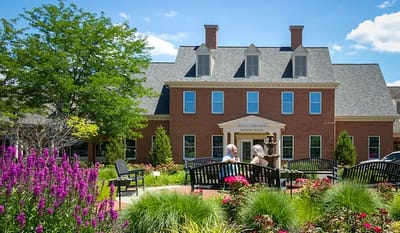 Residents enjoying the garden outside the building.