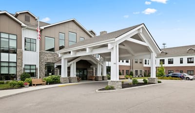 Exterior view of a senior living facility entrance.