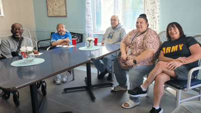 Residents and staff socializing in a common area