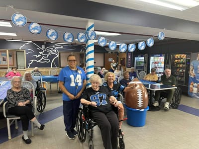 Residents and staff celebrating in a common area