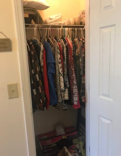 A closet filled with clothing.