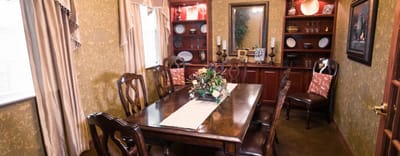 Elegant dining room with stylish decor and a large table