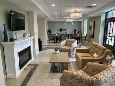 Cozy common area with seating and coffee station