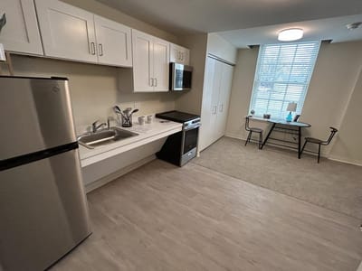 Interior view of a resident's kitchen and seating area