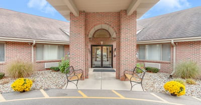 Exterior entrance of Brentwood at Elkhart with garden