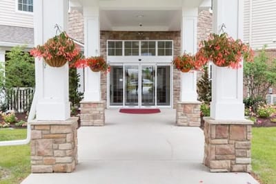 Entrance of the facility with flower baskets