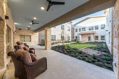 Outdoor courtyard area with seating and landscaping