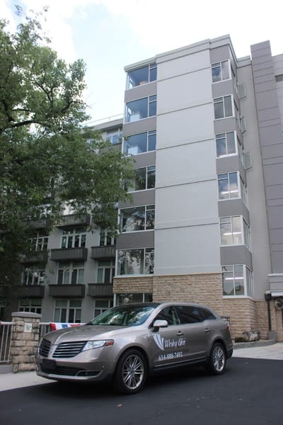 Exterior view of Wesley Glen with facility vehicle