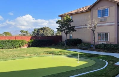 Exterior view of the facility's building and green space