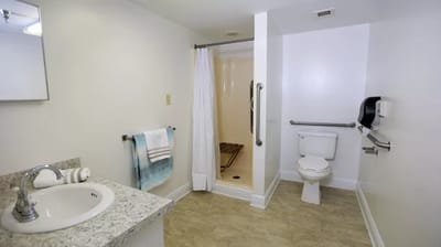Bright and clean bathroom with safety features