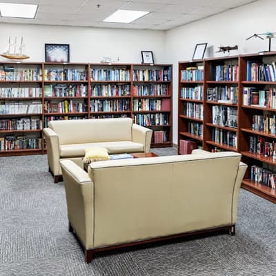 Cozy library with bookshelves and seating