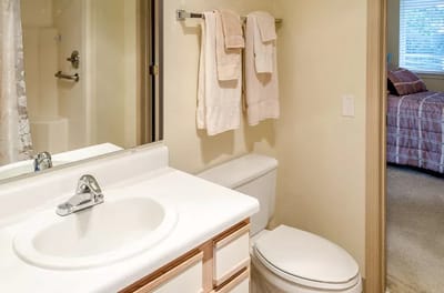 Clean bathroom with towels in a private room