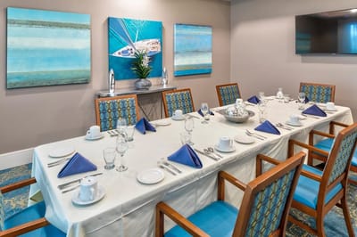 Dining room set for a meal with blue accents