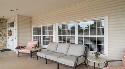 Outdoor seating area with chairs and plants