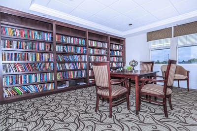 A cozy reading area with bookshelves and seating