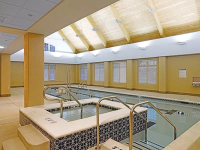 Interior of a therapeutic pool area with wood ceiling