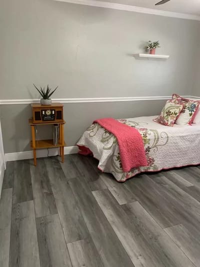 Cozy private resident room with floral bedding