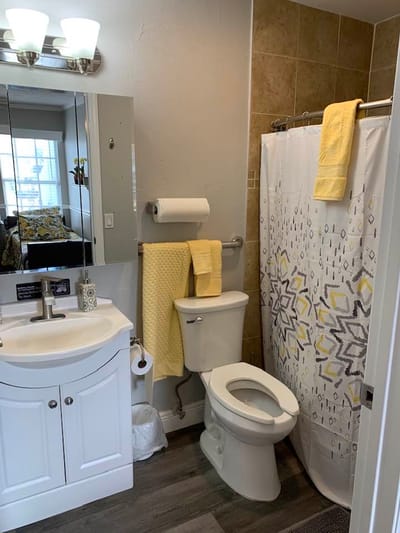 A well-lit bathroom with modern fixtures and decor