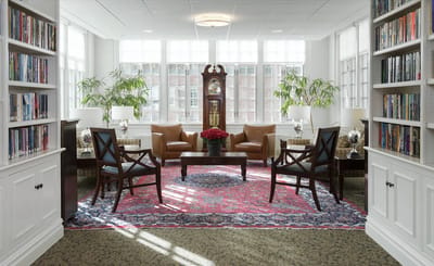 Cozy reading area with comfortable seating and bookshelves