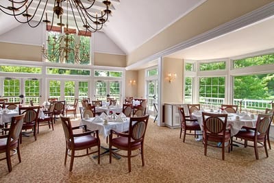 Elegant dining room with tables and chairs arranged
