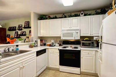 Bright kitchen area with modern appliances
