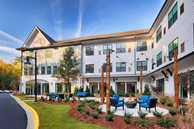 Exterior view of the facility with outdoor seating area