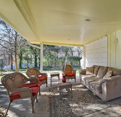 Outdoor seating area with chairs and a couch