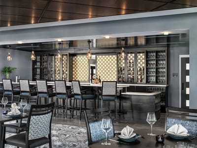 Elegant dining area with a modern bar setup