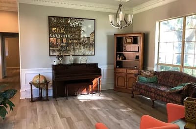 Cozy lounge area with a piano and seating