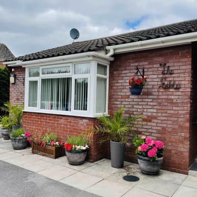 Front entrance of The Gables Residential Care Home with flowers