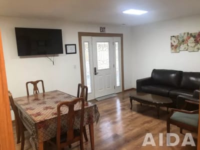 Bright common area with seating and dining table