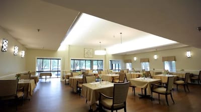 Bright dining area with tables set for meals