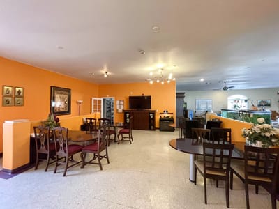 Common area with dining tables and decor