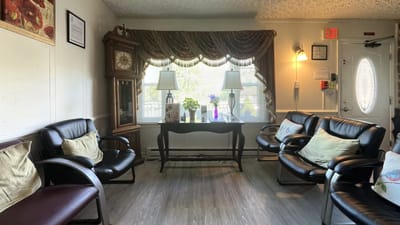 Cozy waiting area with chairs and a clock