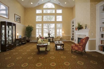 A cozy common area with large windows