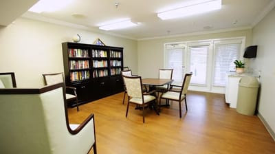 Interior view of a common area with bookshelves and seating