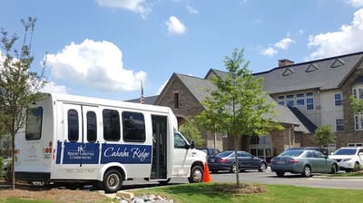 Facility transport van parked outside the building