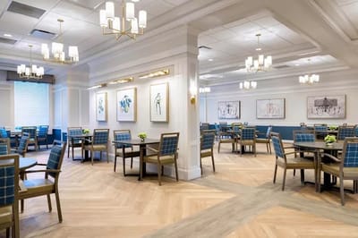 Bright and airy dining room with tables and chairs