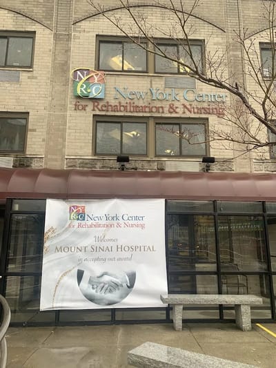 Exterior view of New York Center with award banner