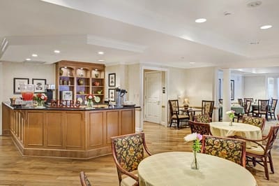 Interior view of a dining area with tables and a bistro counter