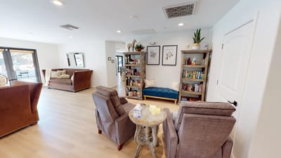 Common area with seating and bookshelves