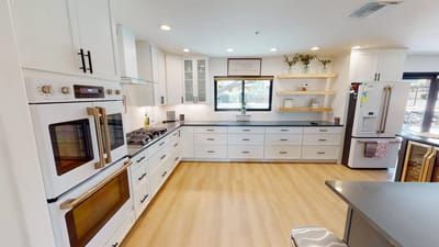 Modern kitchen interior with bright lighting and clean design
