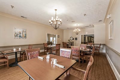 Empty dining room with tables and chairs