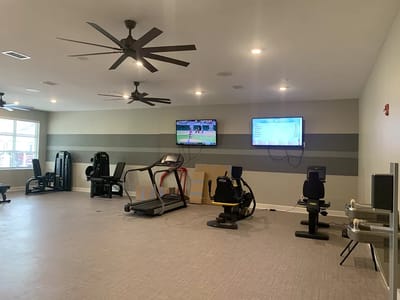 Interior photo of a fitness room with equipment