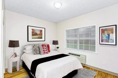 Cozy bedroom with bed and artwork