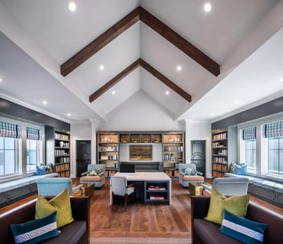 Bright common area with bookshelves and seating