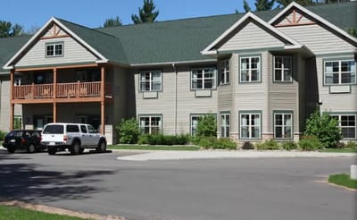 Exterior view of a senior living facility with landscaping